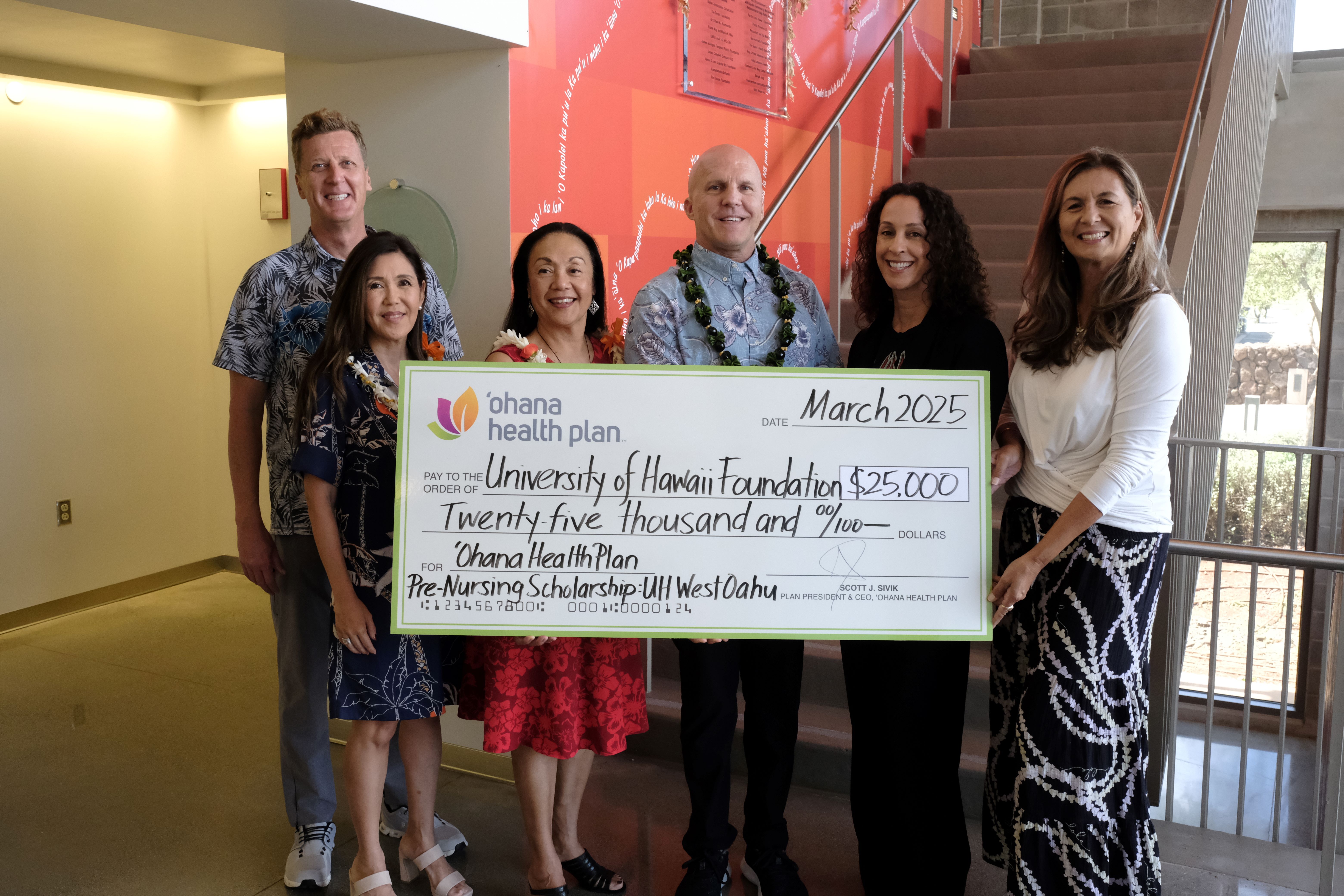 UHWO present a check