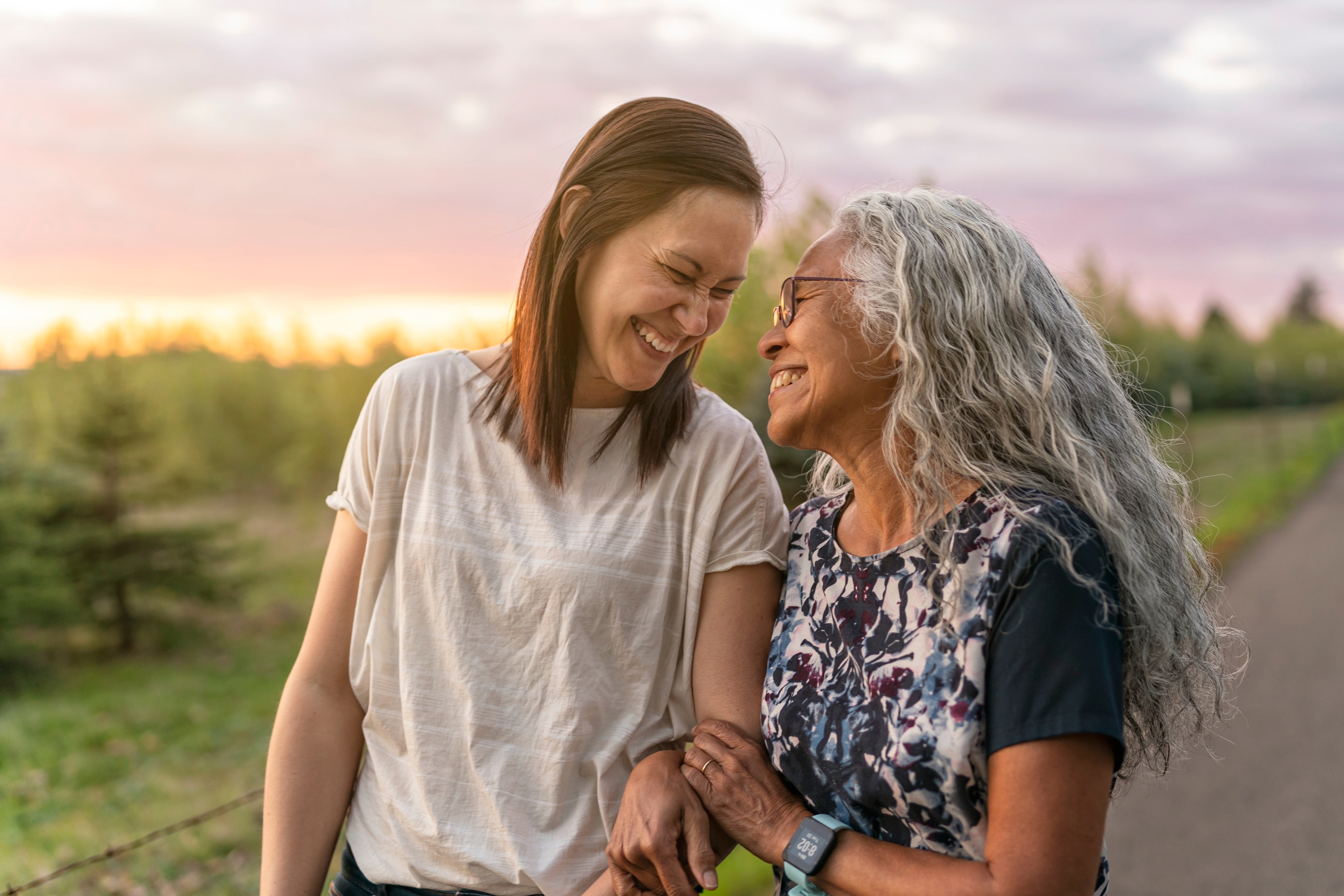 young woman, older woman walking